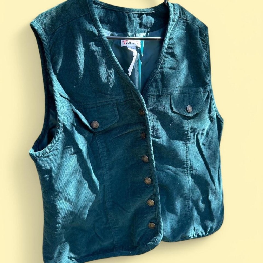 Forest green corduroy vest with button-up front and pockets